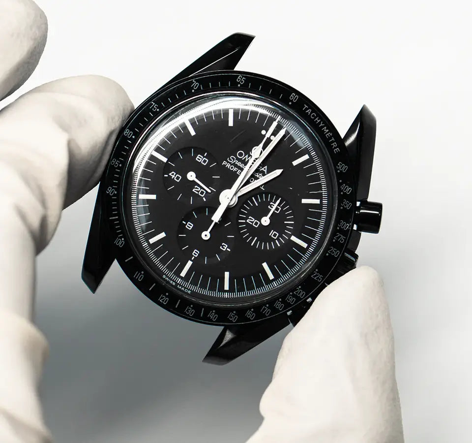 Omega Speedmaster Professional in black PVD with chronograph sub-dials and tachymetre scale