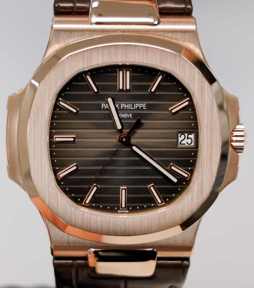 Patek Philippe Nautilus in rose gold with charcoal embossed dial and brown leather strap