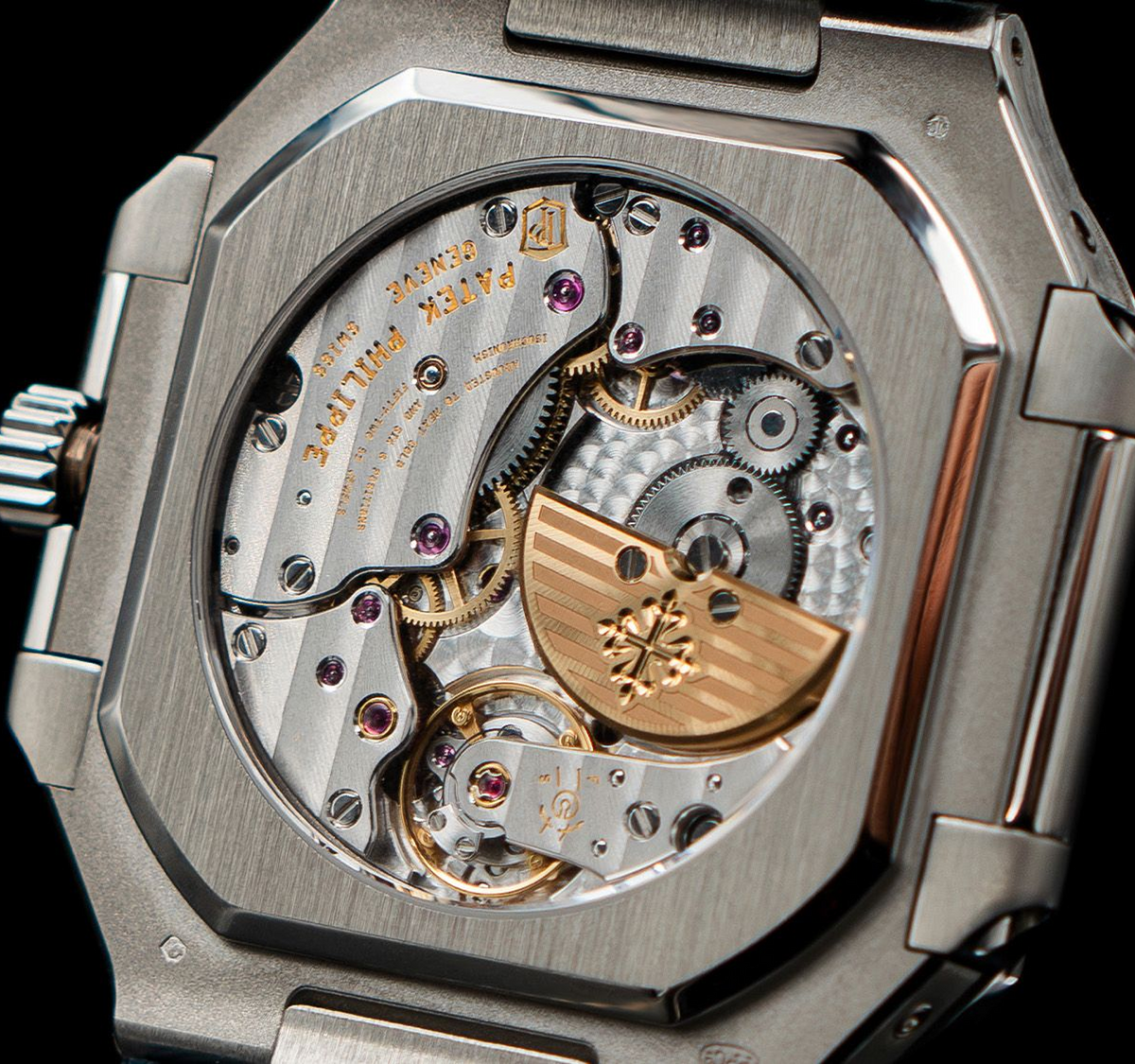 Open caseback view of a Patek Philippe Nautilus automatic movement with gold rotor